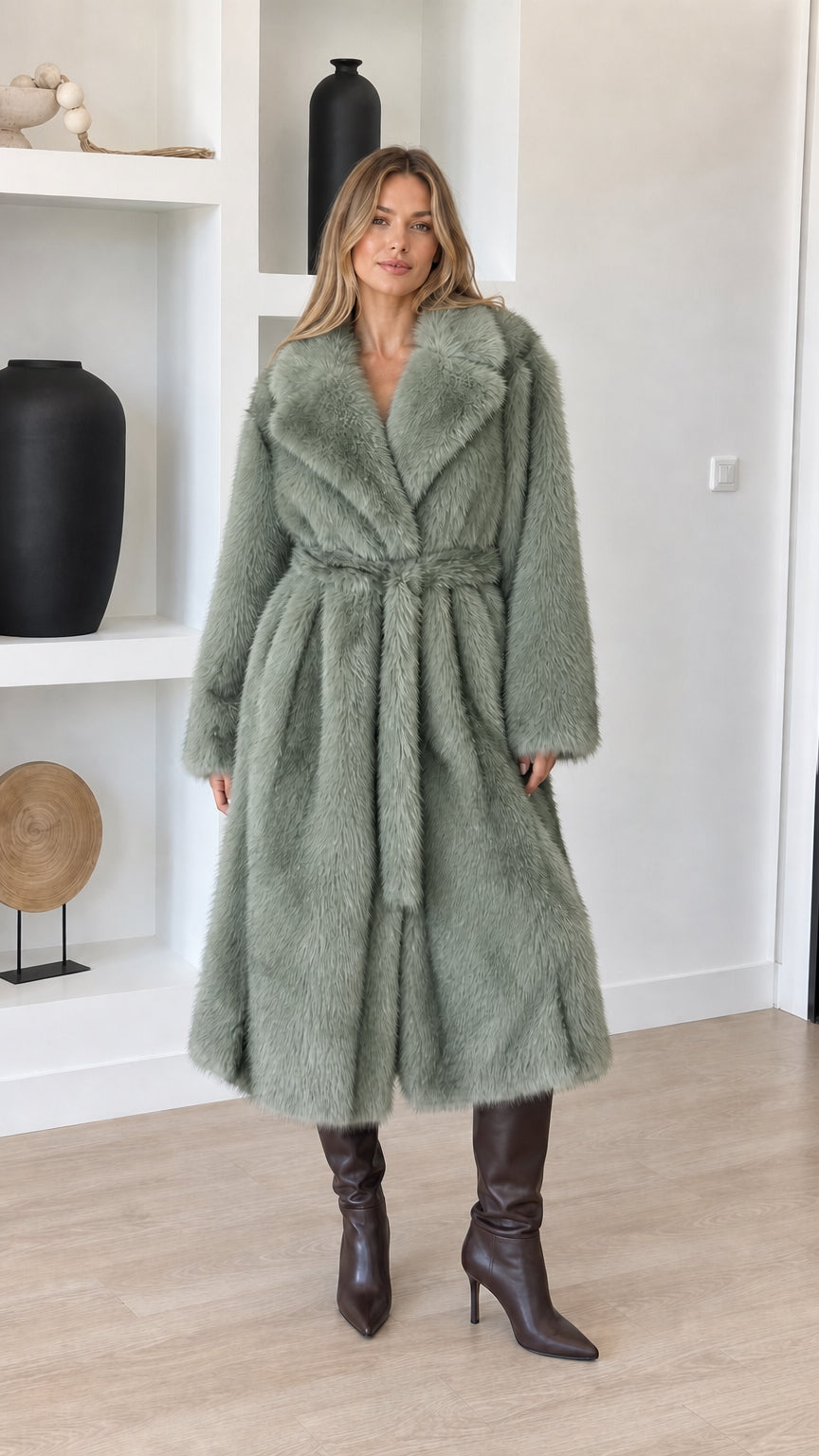 Full-length view of model wearing sage green plush faux fur longline belted coat
