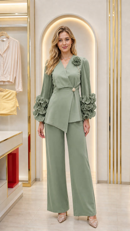 Full front view of sage green two-piece formal pant suit with dramatic sleeves
