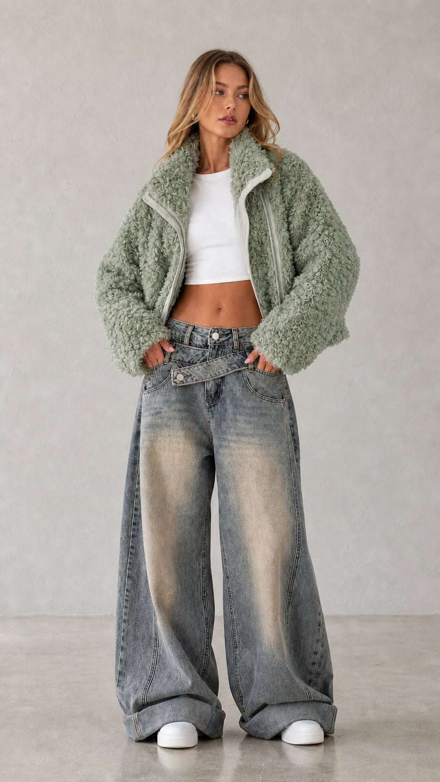 Full body studio shot of woman wearing sage green cropped teddy fleece jacket