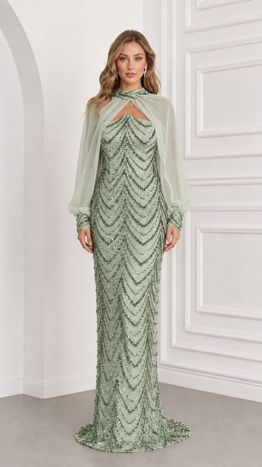 Front view of sage green sequined evening gown with matching sheer chiffon capelet