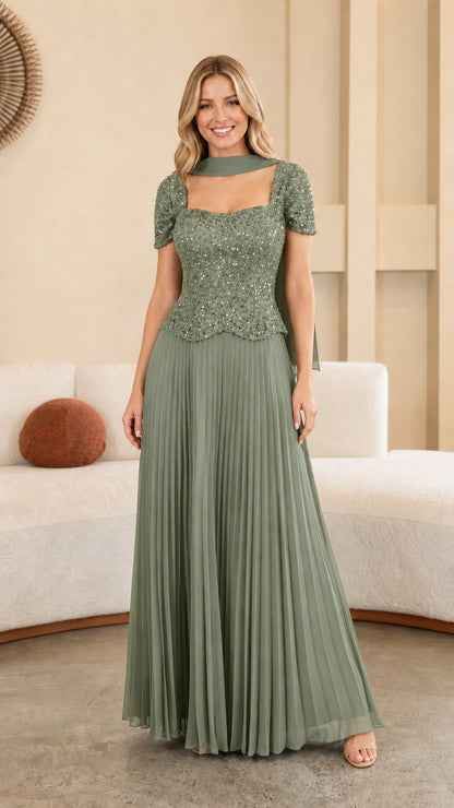 Model wearing Sage Green sequined bodice pleated maxi formal gown