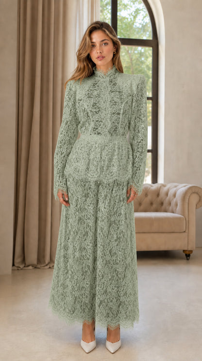 Front full view of woman wearing sage green lace wide leg evening jumpsuit