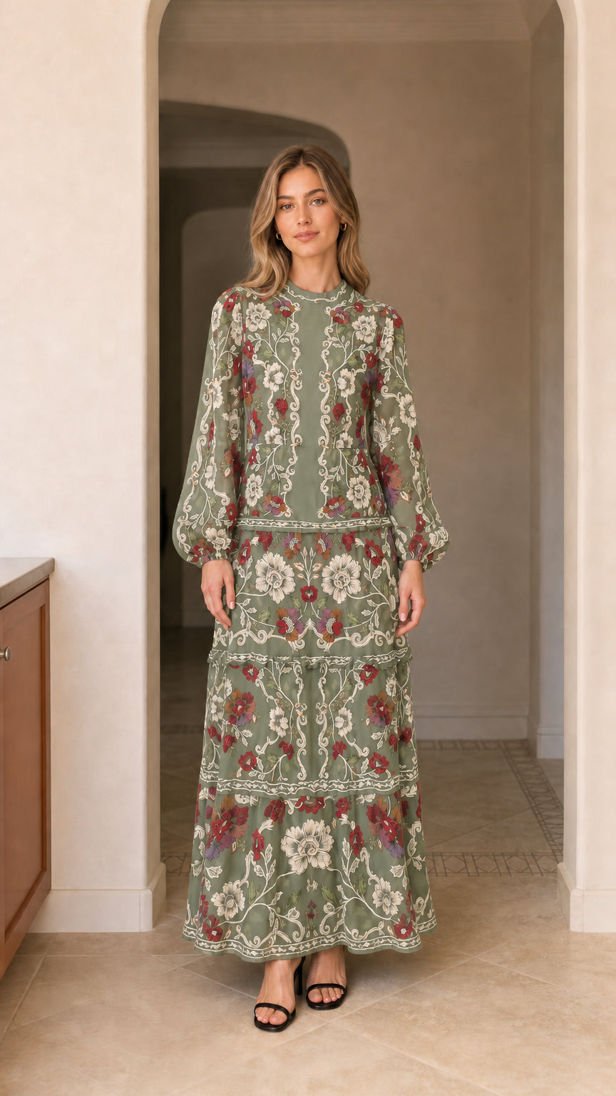 Model wearing long sleeve tiered floral maxi dress in sage green