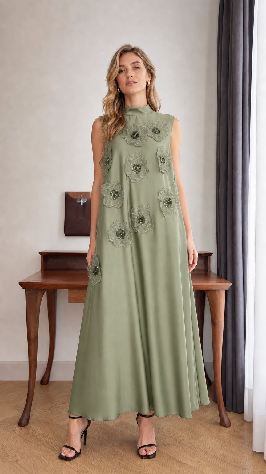 Model wearing Sage Green sleeveless 3D floral applique high neck maxi dress