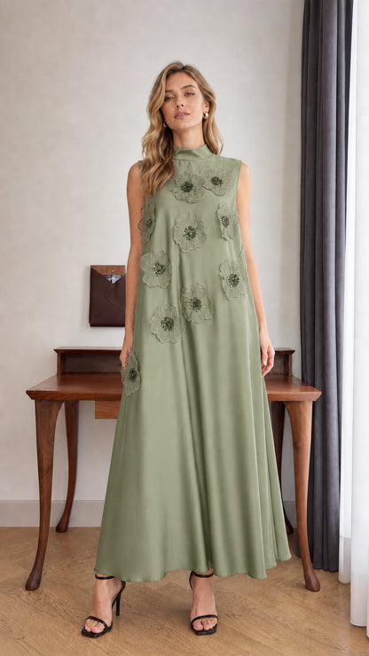 Model wearing Sage Green sleeveless 3D floral applique high neck maxi dress