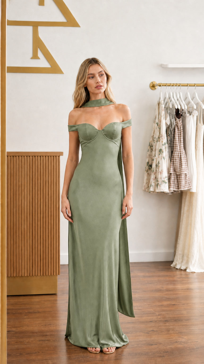 Model wearing sage green satin off-shoulder bustier maxi dress - front view