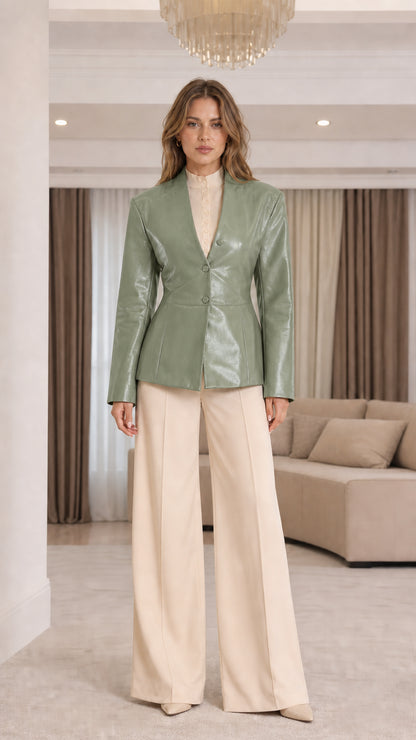 Front view of model wearing Sage Green collarless faux leather blazer