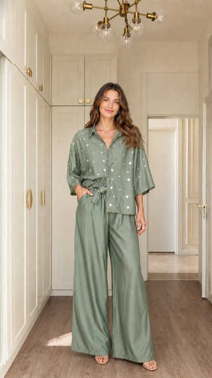 Model wearing Sage Green polka dot button-down shirt and wide-leg trousers set