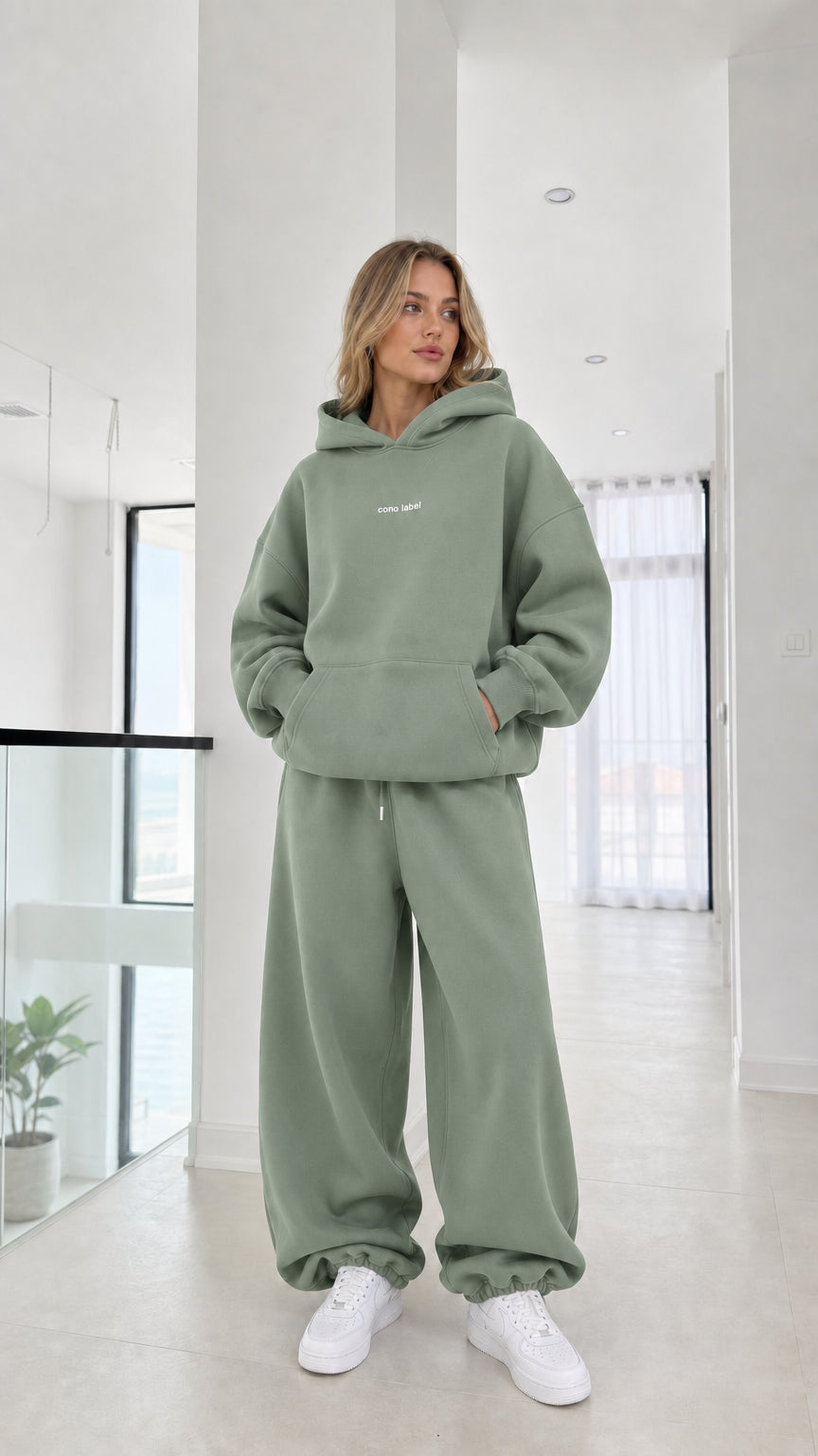 Full-length view of model wearing the sage green fleece tracksuit set