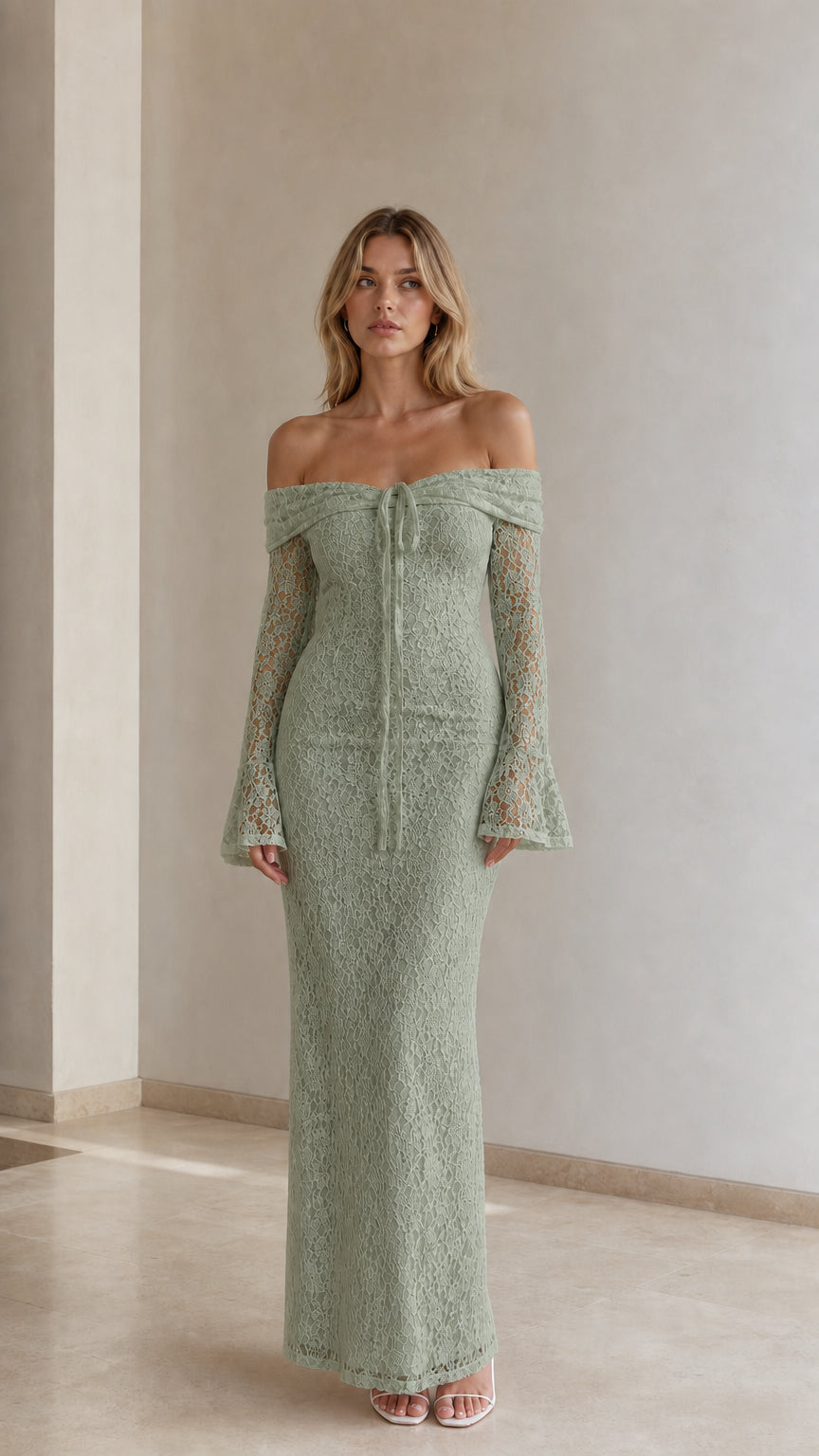 Woman wearing sage green off-the-shoulder lace maxi dress with flare sleeves