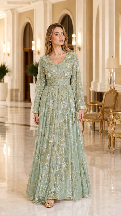 Model wearing sage green and gold metallic embroidered long sleeve kaftan dress