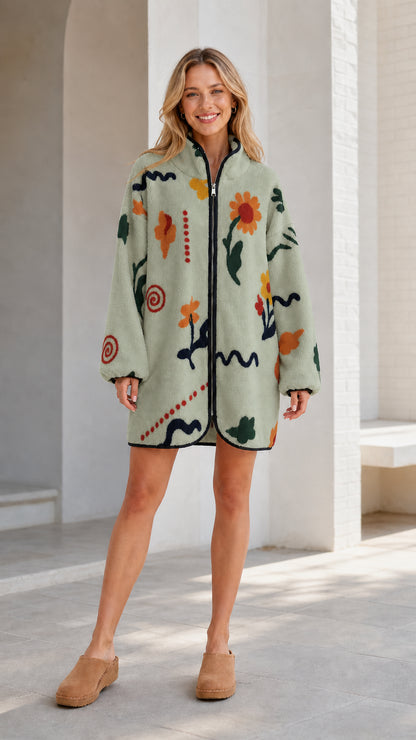 Front view of a sage green women's floral printed fleece zip-up jacket