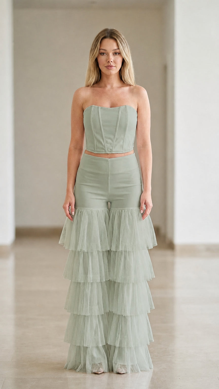 Sage green two-piece formal set with strapless bodice and tiered tulle pants