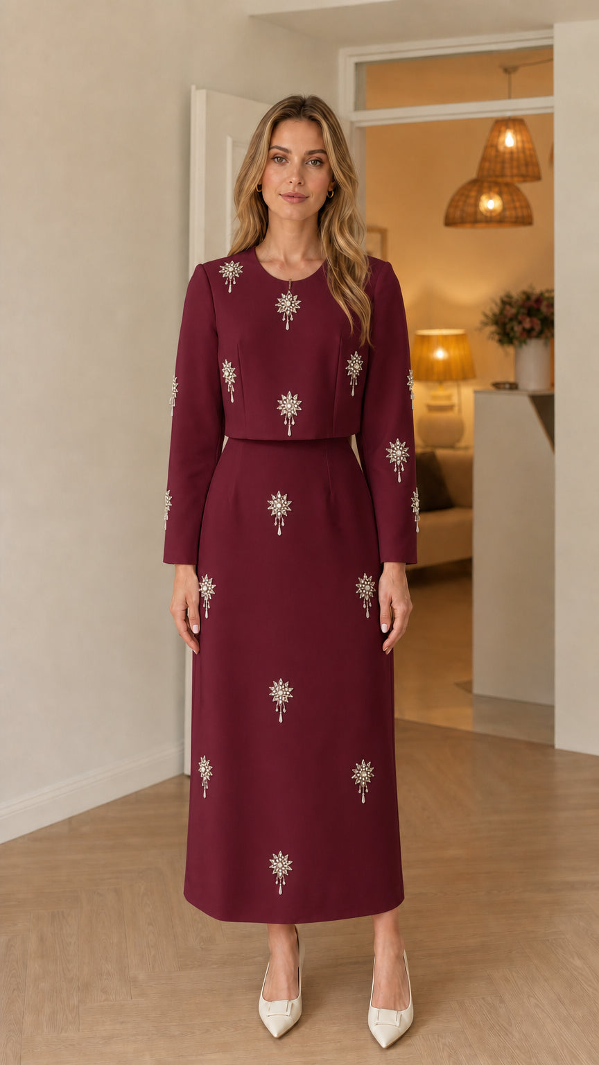 Front view of woman wearing burgundy wine long sleeve embellished maxi dress
