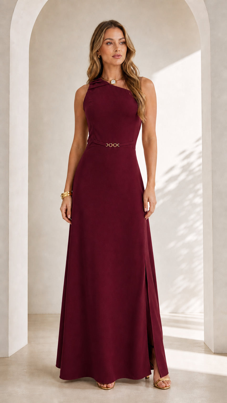 Front full view of woman wearing burgundy wine sleeveless asymmetrical maxi dress