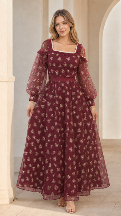 Model wearing burgundy floral embroidered evening gown