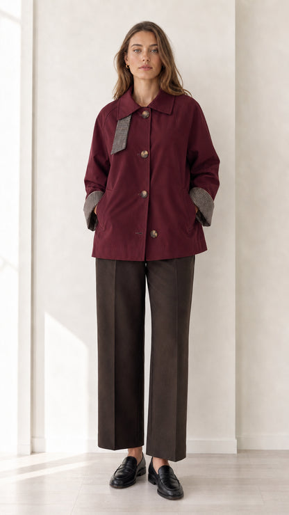 Front view of women's burgundy wine short trench jacket with houndstooth detail