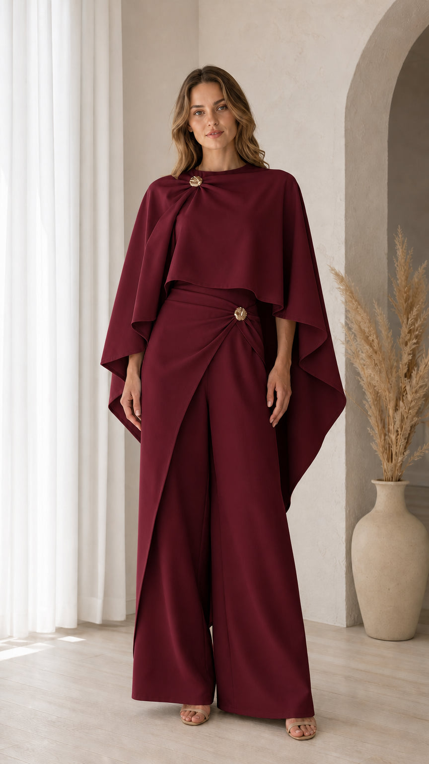 Front view of model wearing Burgundy wine red formal cape pants set