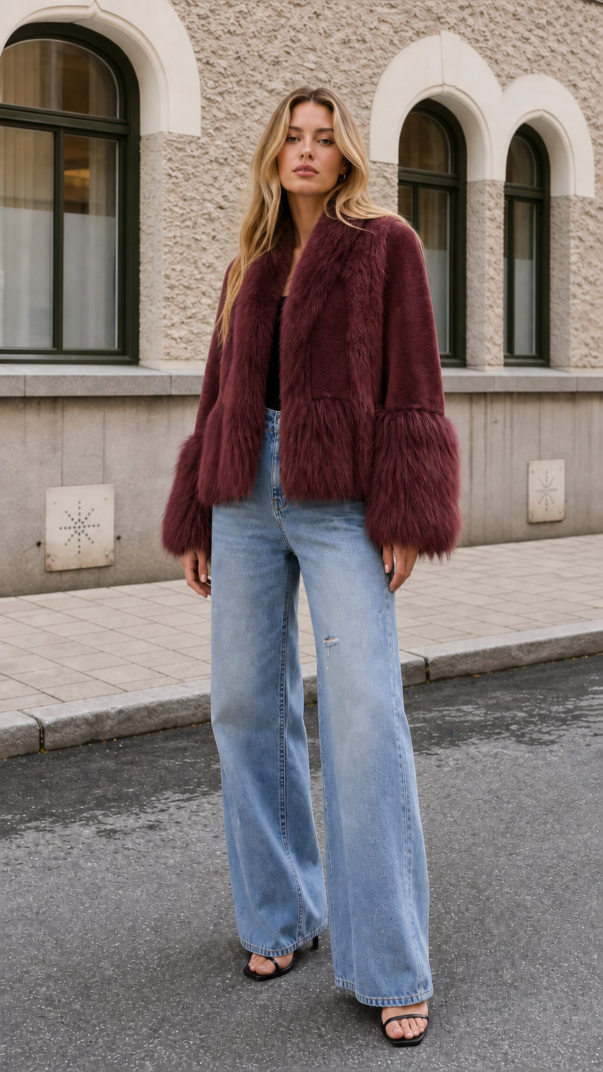 Model wearing rich burgundy faux fur cropped jacket