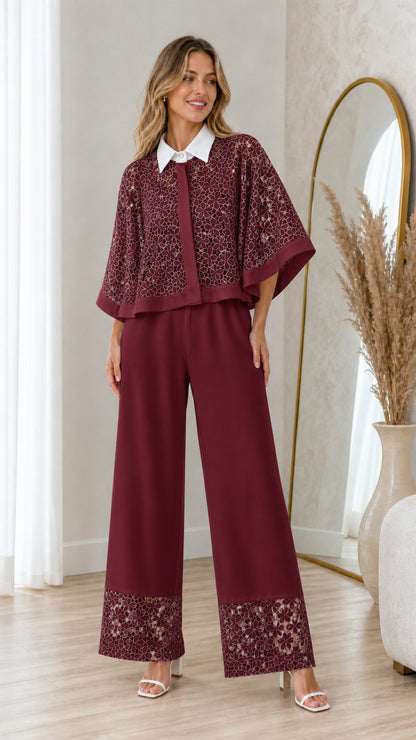 Model wearing burgundy floral lace top with white collar and matching pants