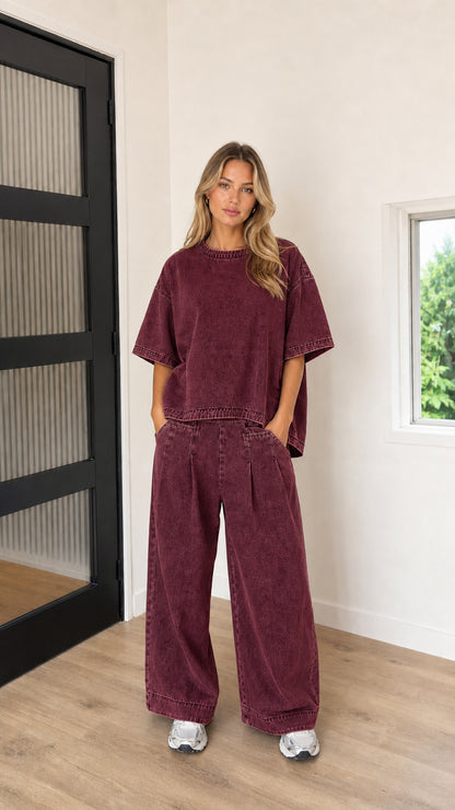 Model wearing Washed Burgundy mineral wash oversized t-shirt and wide-leg pants set