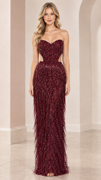 Front view of burgundy strapless beaded fringe evening maxi gown