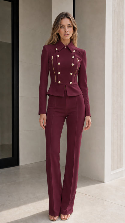 Model wearing burgundy red double-breasted peplum blazer and flared trousers suit set