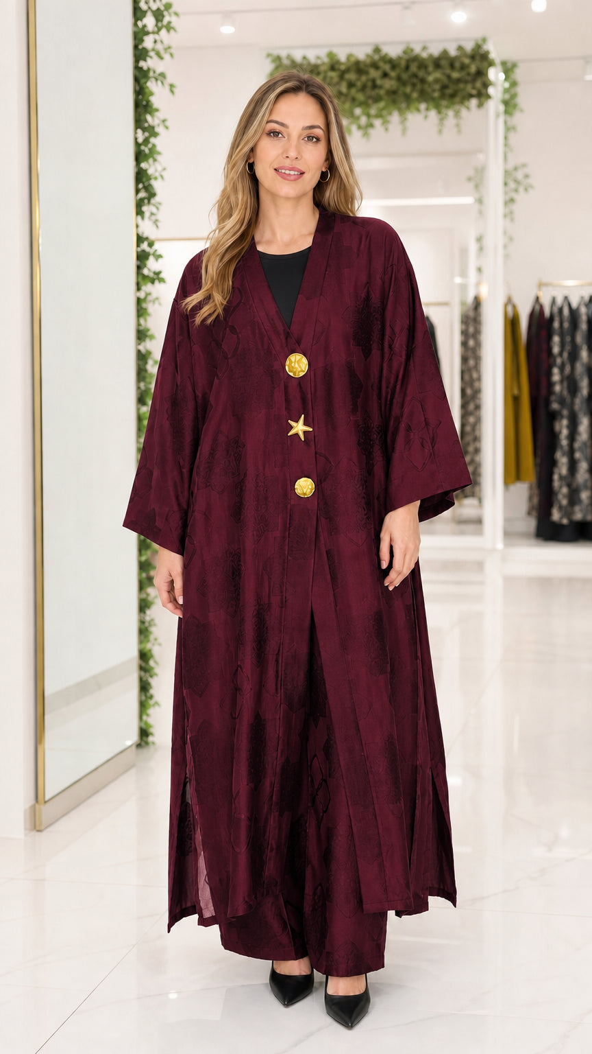 Front view of burgundy wine red jacquard maxi abaya with gold buttons
