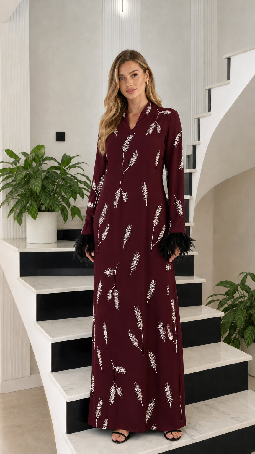 Front view of burgundy wine red embroidered maxi dress with feather trim