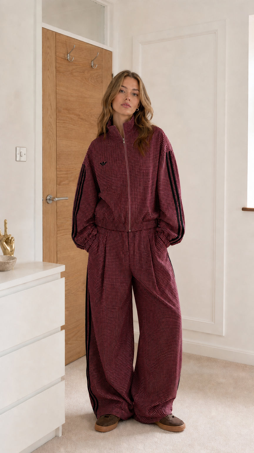 Burgundy gingham women's track stripe jumpsuit shown from the front