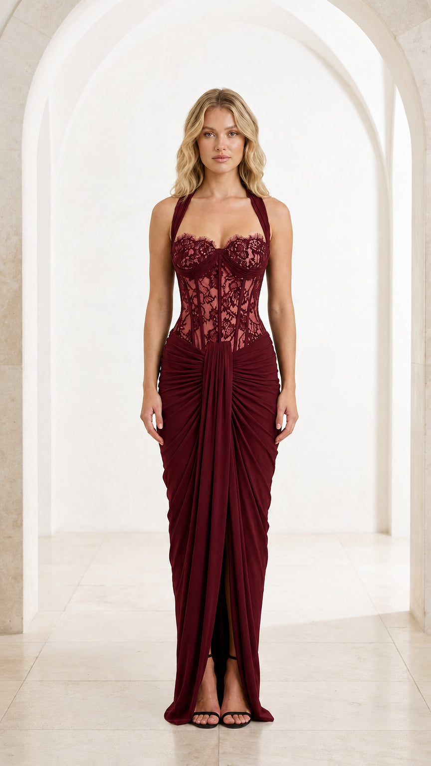 Front view of burgundy red halter lace corset draped maxi gown