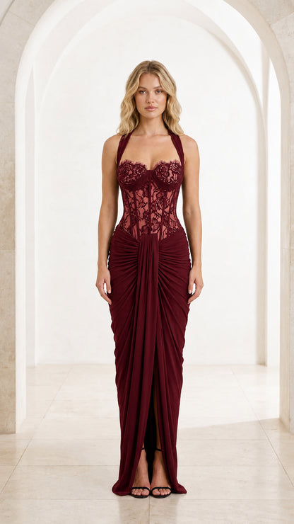 Front view of burgundy red halter lace corset draped maxi gown