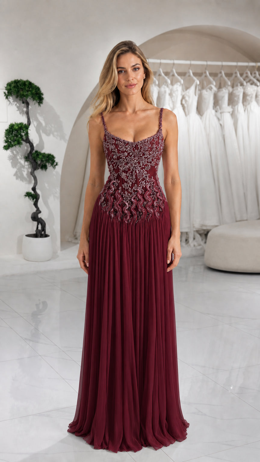 Front view of burgundy red embellished pleated formal gown