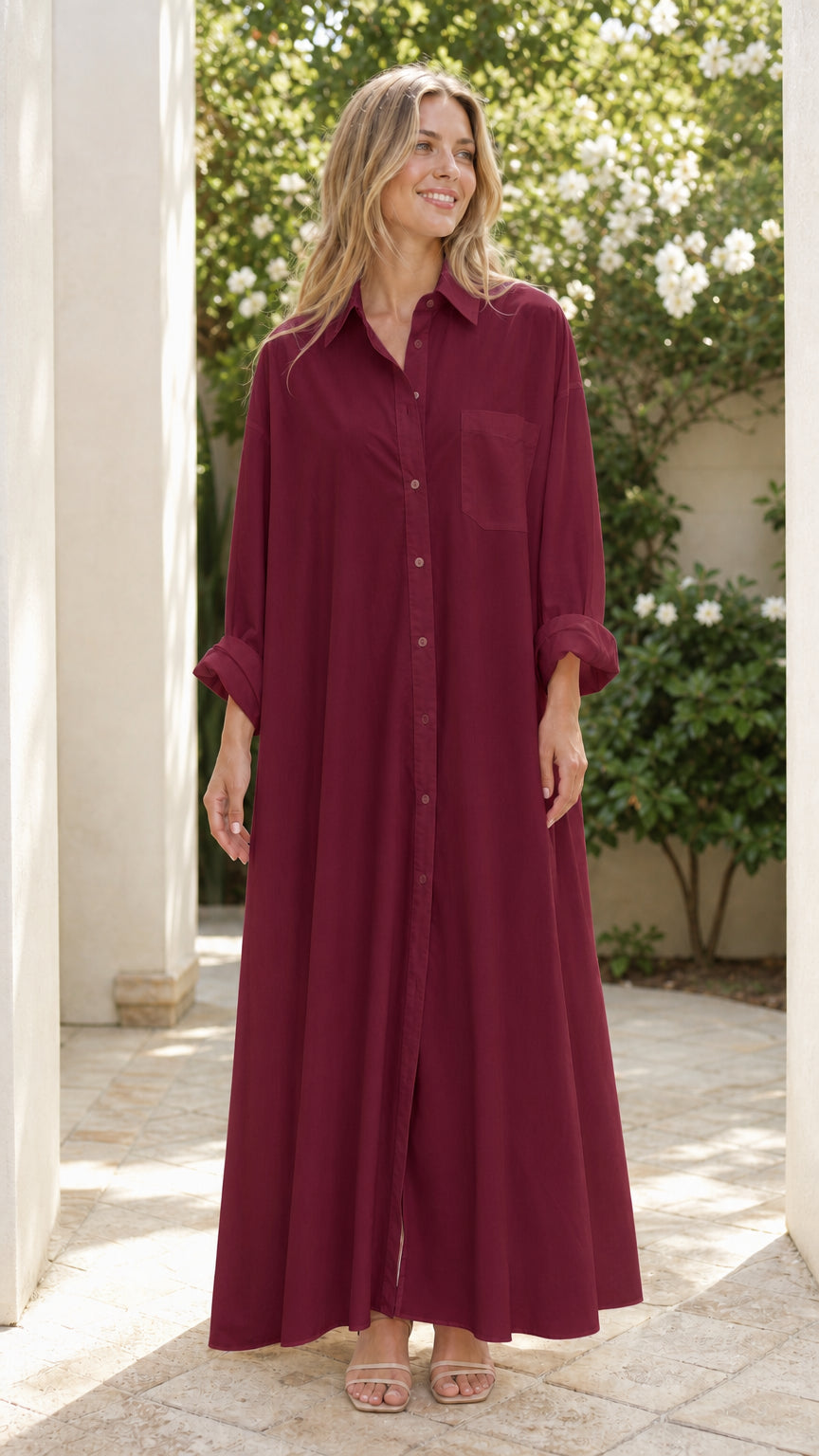 Woman wearing rich burgundy button-down floor-length shirt dress