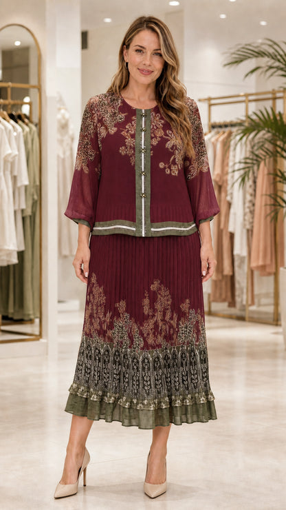 Model wearing burgundy floral print blouse and pleated midi skirt set