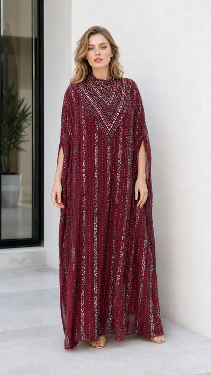 Model wearing burgundy red sequined cape sleeve formal kaftan dress