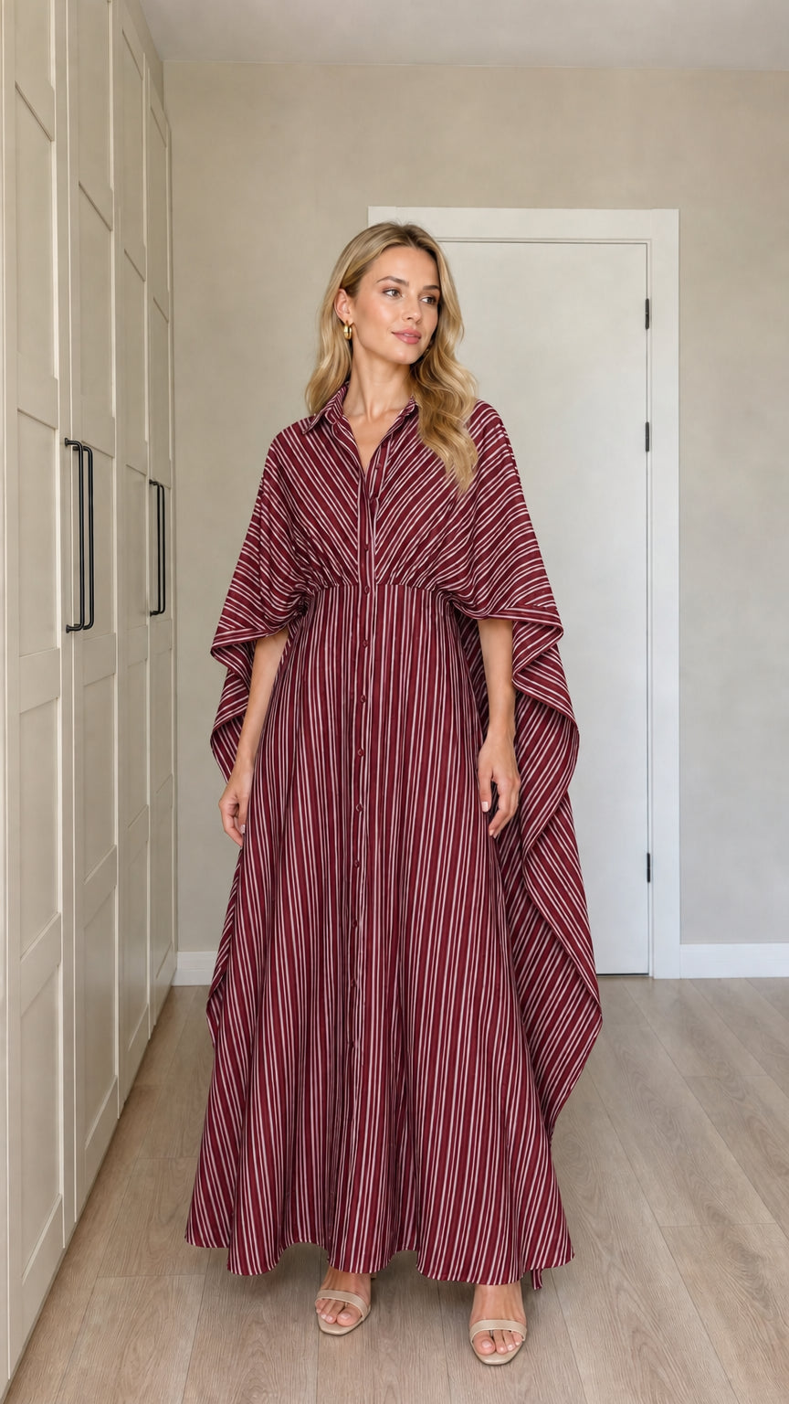 Front view of woman wearing burgundy wine striped cape sleeve maxi dress