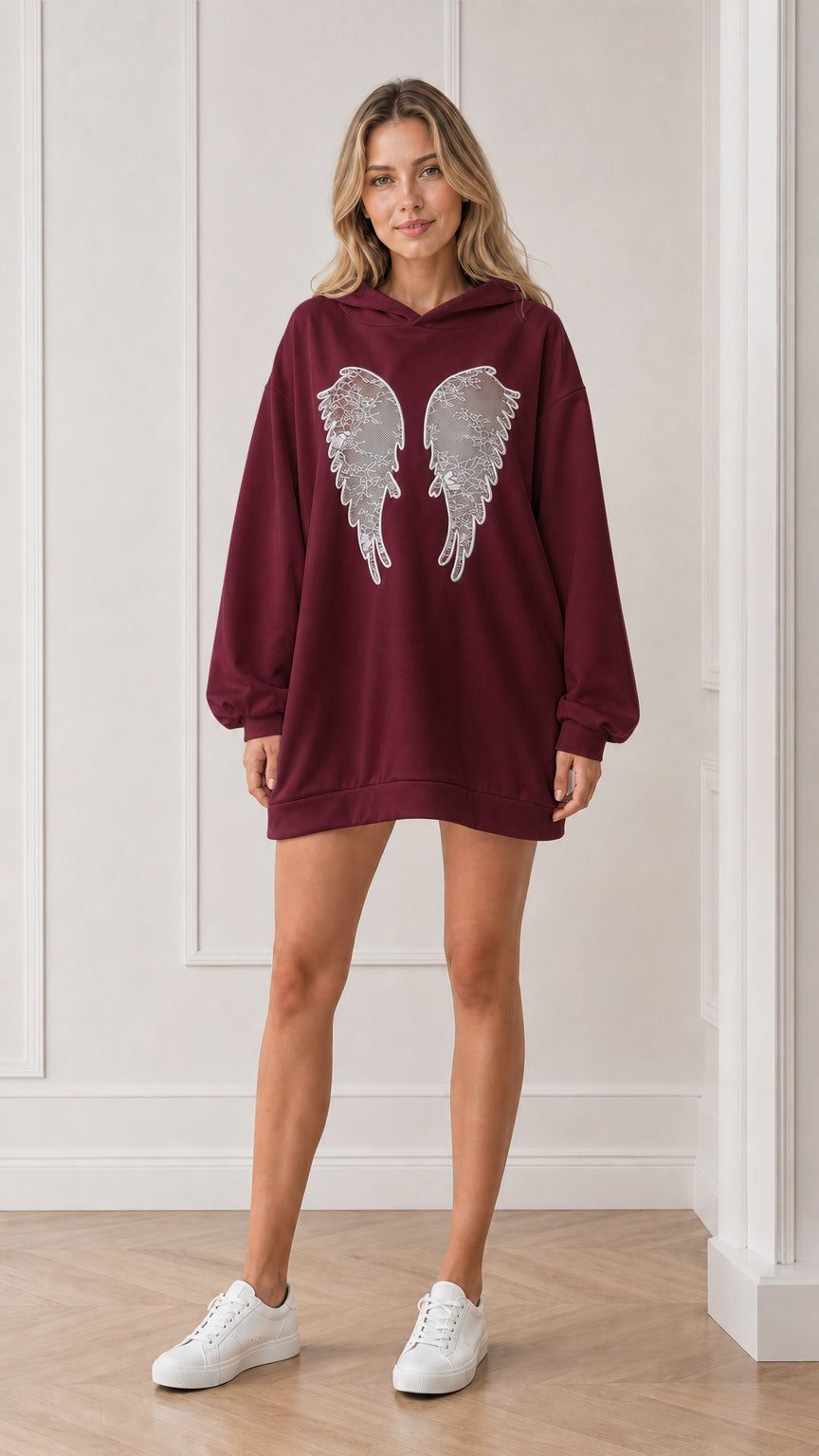 Front view of model wearing the burgundy oversized angel wings hoodie dress