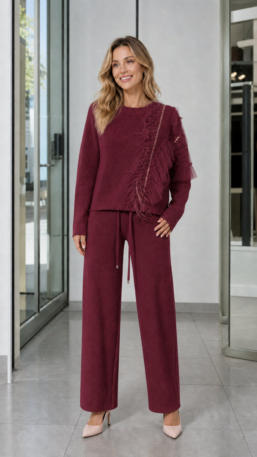 Full-length front view of woman wearing Burgundy knit sweater and wide-leg pants set