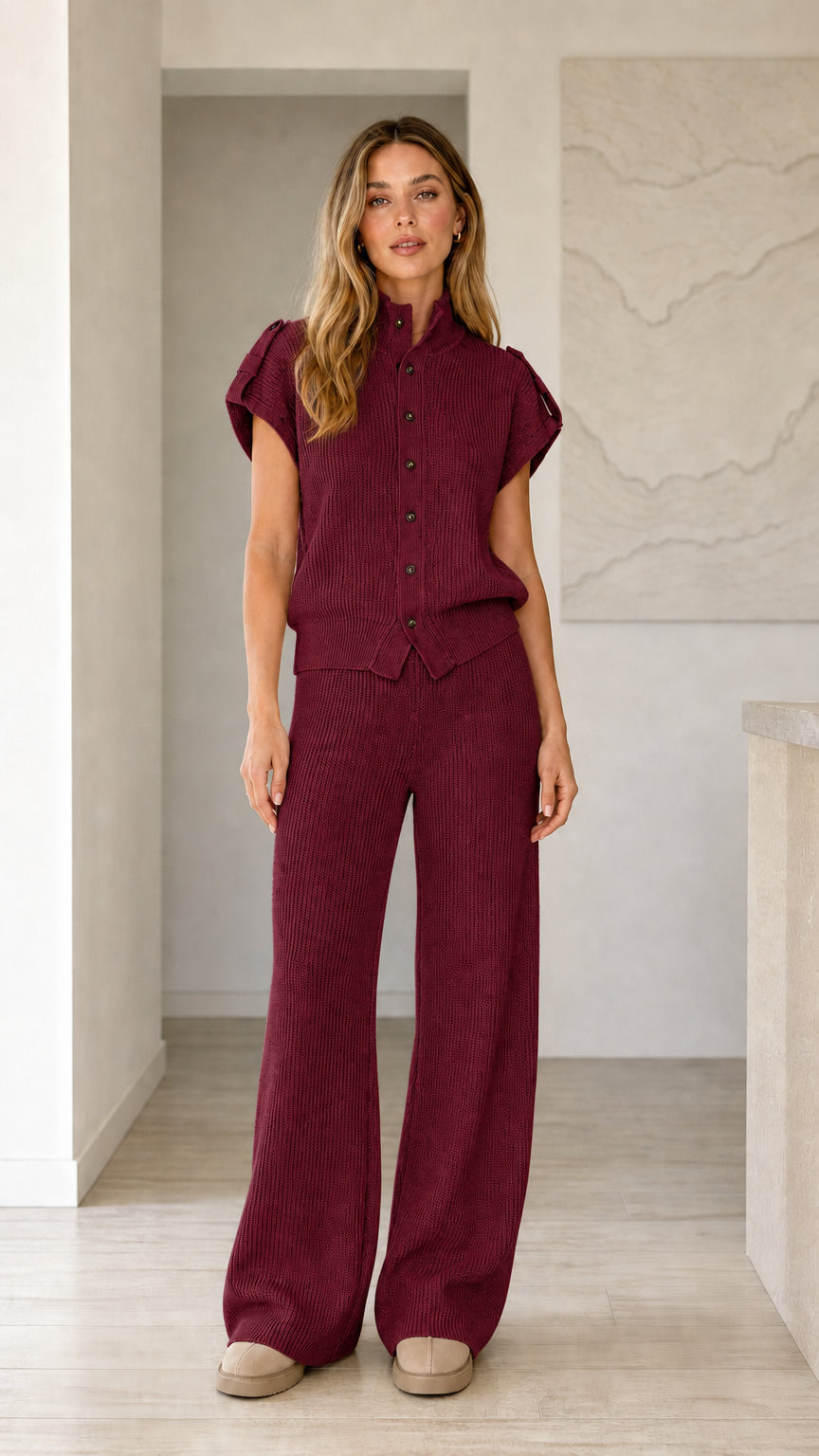 Front view of model wearing burgundy ribbed knit button top and wide leg pants set