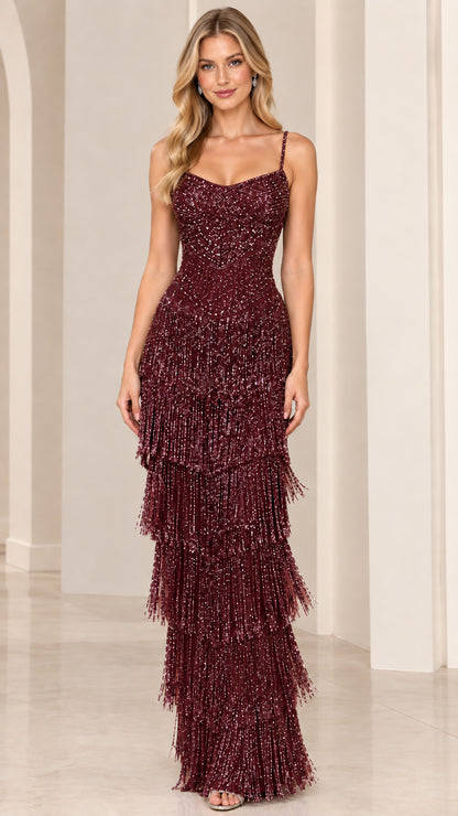 Model wearing Burgundy wine sequin tiered fringe formal gown