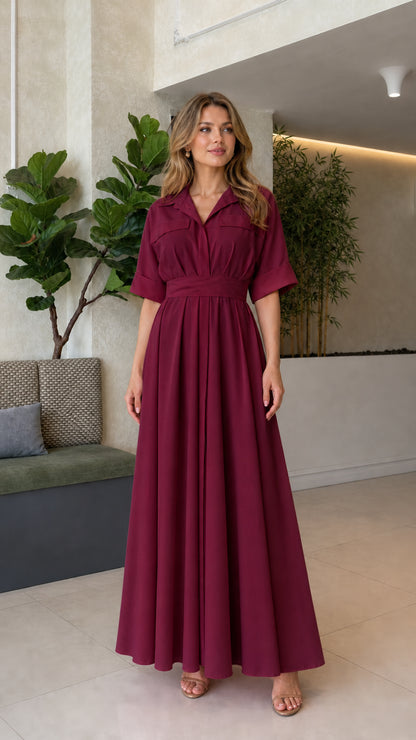 Front full view of woman wearing burgundy wine collared pleated maxi dress