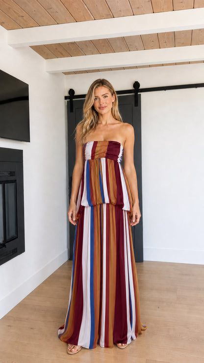 Front view of model wearing Burgundy Multi striped strapless maxi dress
