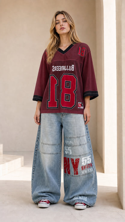 Full front view of burgundy maroon oversized number graphic mesh jersey
