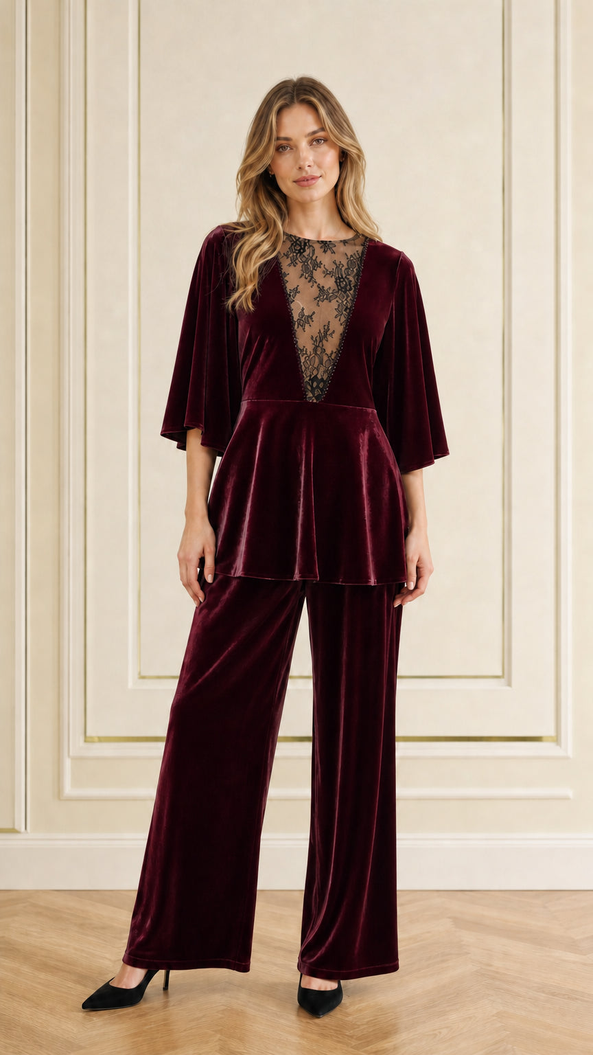 Front view of woman wearing rich burgundy red velvet two-piece pant set