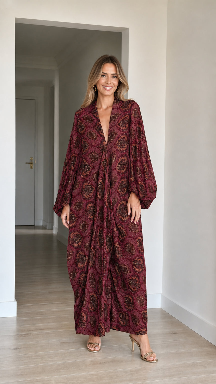 Model wearing Burgundy red paisley long sleeve maxi kaftan dress
