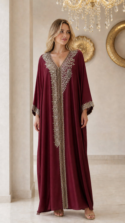 Front view of model wearing burgundy embellished kaftan maxi dress