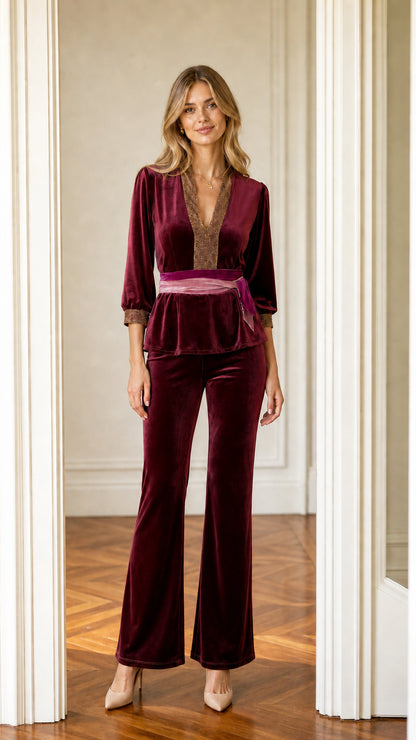 Front view of burgundy velvet peplum top and flare pants two-piece set