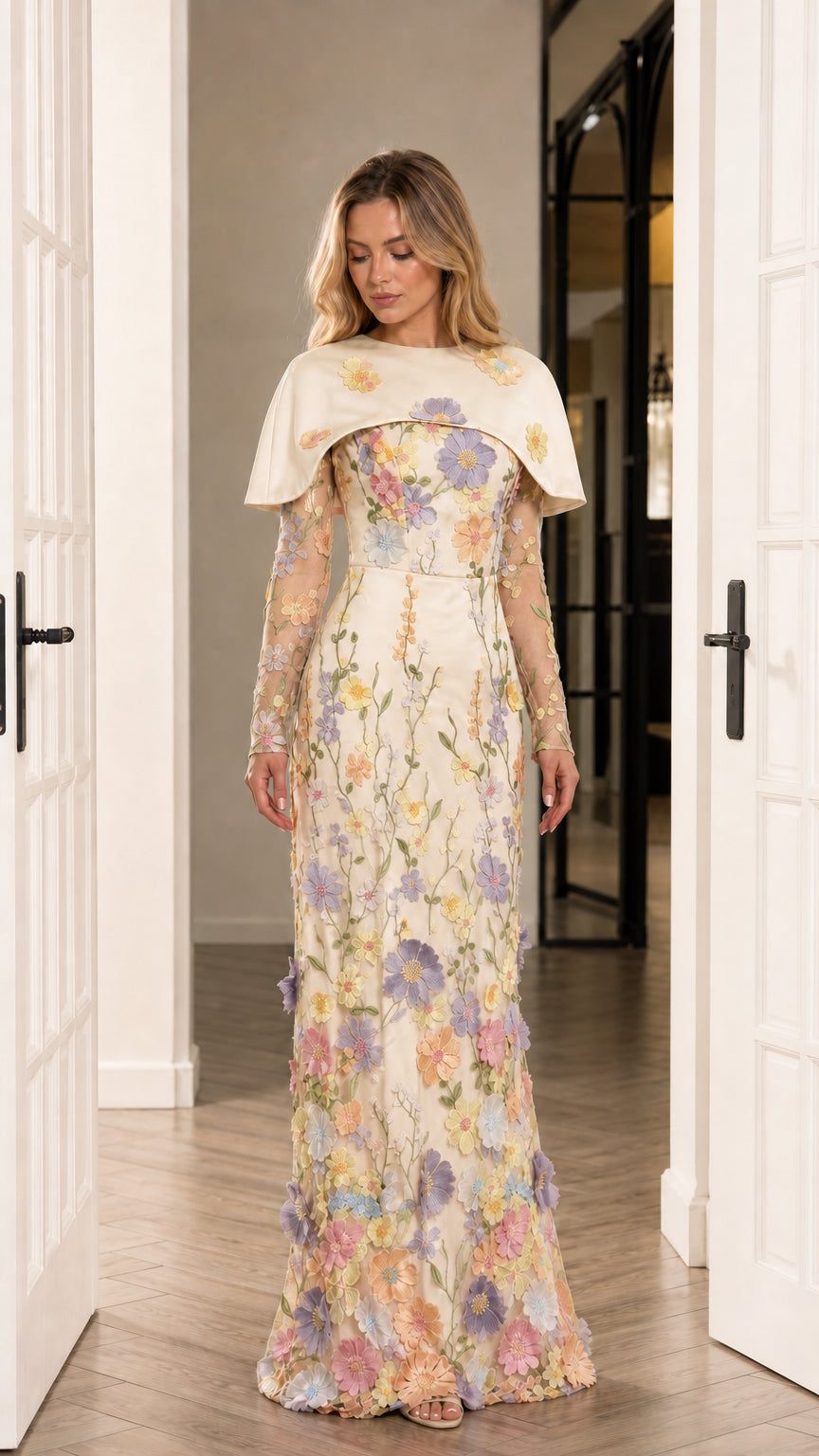 Front view of champagne cream floral applique floor-length formal dress with capelet
