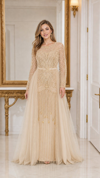 Front view of woman wearing champagne gold long sleeve beaded tulle evening gown